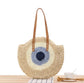 Handwoven Round Straw Shoulder Bag with Evil Eye Design